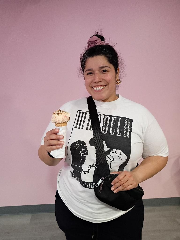 Guest holding an ice cream cup at Scoops