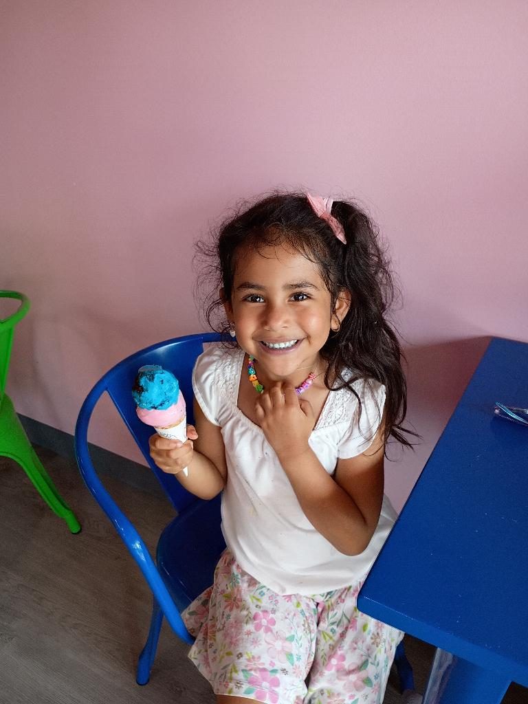 Young guest with an ice cream cup