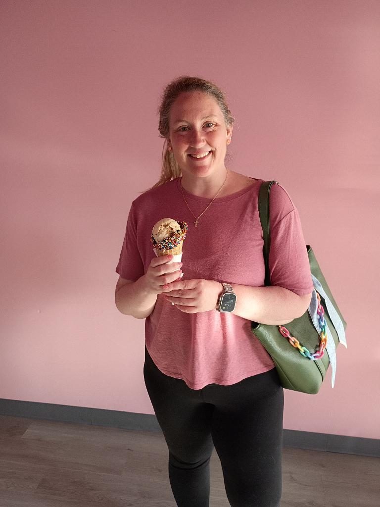 Guest with a waffle cone outside the shop